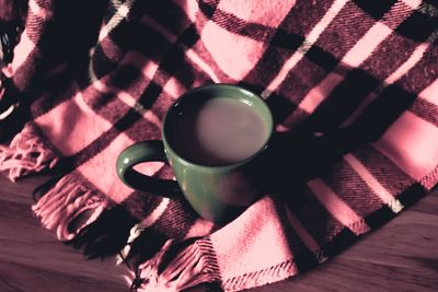 High angle view of coffee cup on table