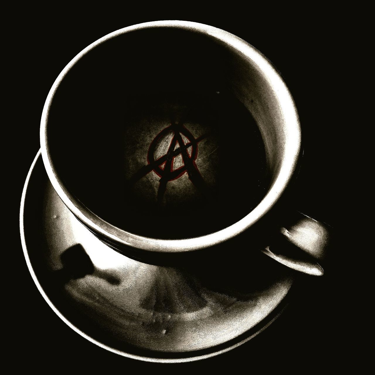 HIGH ANGLE VIEW OF COFFEE CUP ON TABLE AT BLACK BACKGROUND