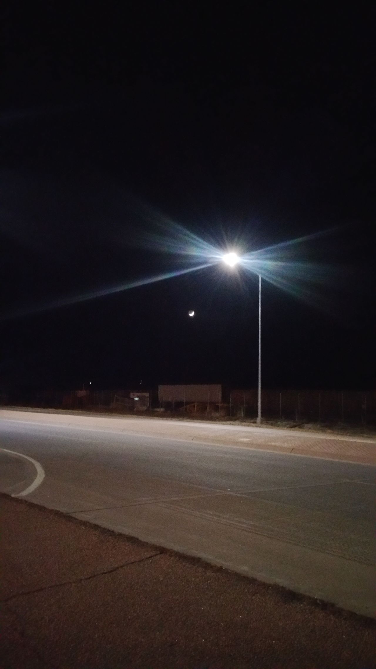 Moon under street light