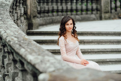 Portrait of woman sitting outdoors