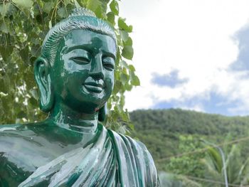 Buddha statue against sky