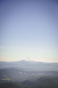 Scenic view of mountains against clear blue sky