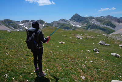 Girl trekking in the paths of the mountains of the abruzzo lake