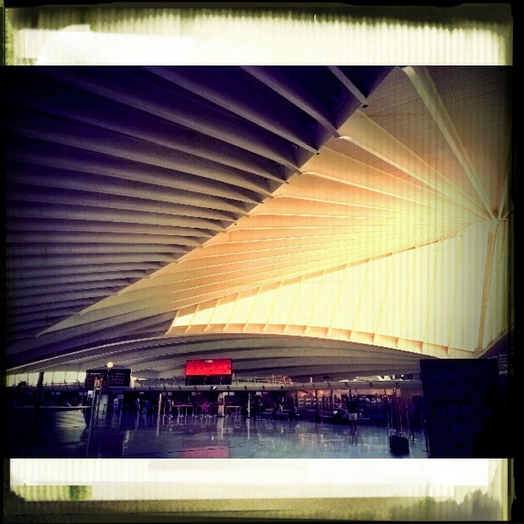 transfer print, auto post production filter, built structure, architecture, transportation, indoors, connection, railroad station platform, railroad station, low angle view, bridge - man made structure, illuminated, railing, incidental people, building exterior, modern, no people, ceiling, public transportation, city