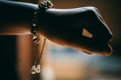 Cropped hand of woman wearing bracelet