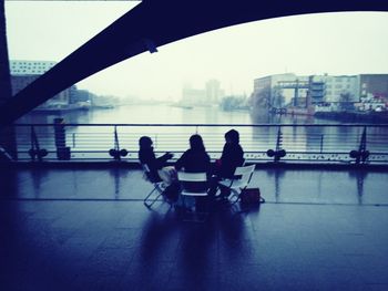 People sitting in river