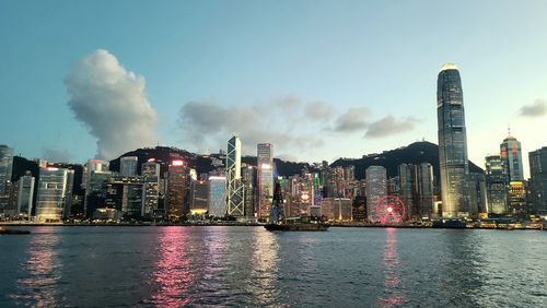Panoramic view of river and buildings against sky