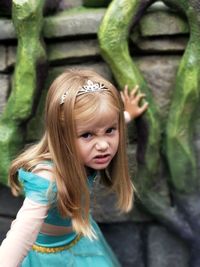 Close-up portrait of girl standing outdoors