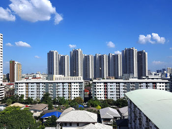 Modern buildings against sky in city