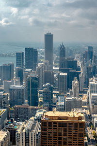 High angle view of buildings in city against sky