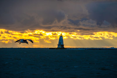 Scenic view of sea against sky during sunset