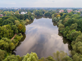 Scenic view of trees and landscape against sky