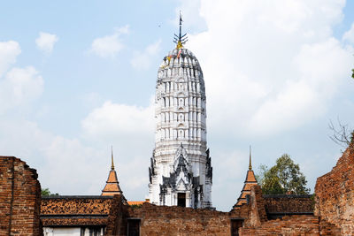 Low angle view of temple against cloudy sky