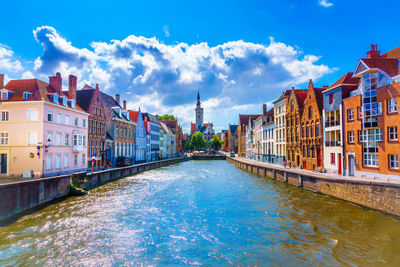 Canal amidst buildings in city