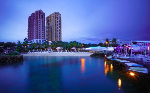 Reflection of illuminated buildings in water at night