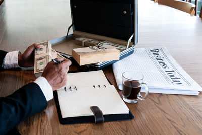 High angle view of man using laptop on table