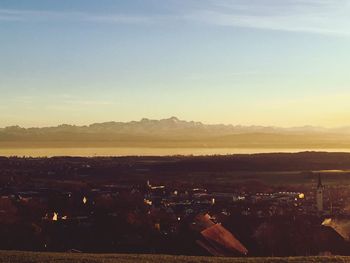 View of town against sky during sunset