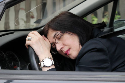 Portrait of woman in car