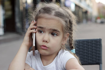 Portrait of young woman using mobile phone