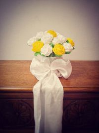 Close-up of roses in vase on table