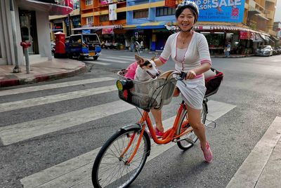 Woman riding bicycle on street