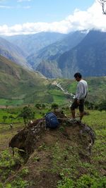 Full length of man standing against mountains