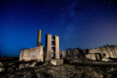 Old ruin against sky at night