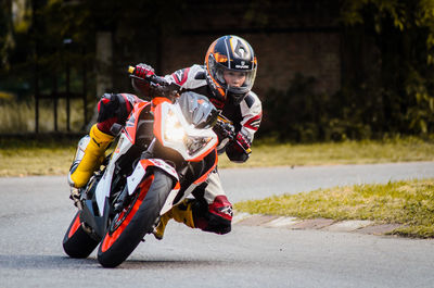 Man riding motorcycle on road