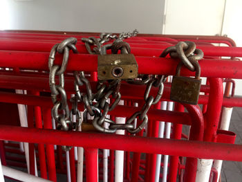 Close-up of padlocks on metal railing