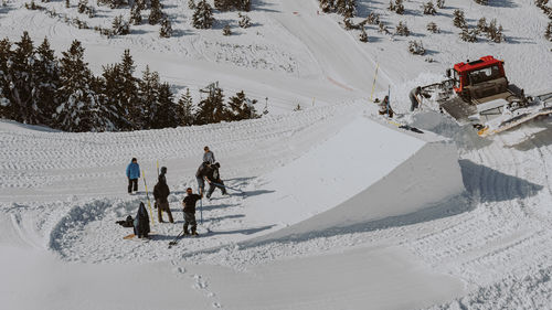 People walking on snow covered land