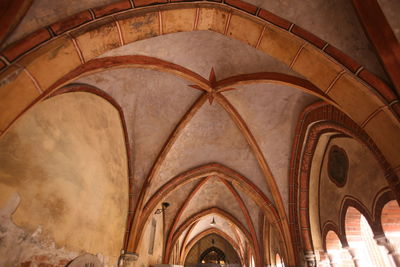 Low angle view of ribbed vault ceiling at church