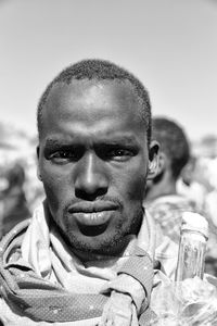 Portrait of young man wearing sunglasses against sky