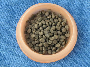 High angle view of blueberries in bowl on table
