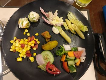 High angle view of vegetables in cooking pan on table