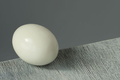 High angle view of apple on table against wall