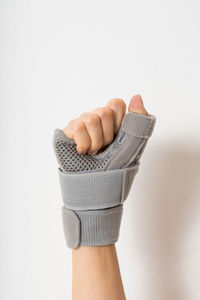Close-up of hand against white background