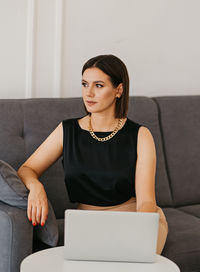 Beautiful business brunette working on a laptop. confident and independent woman