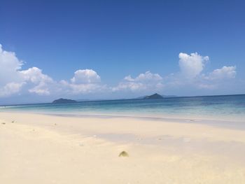 Scenic view of sea against blue sky