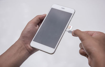 Midsection of person using mobile phone