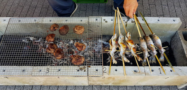 High angle view of fish on barbecue grill