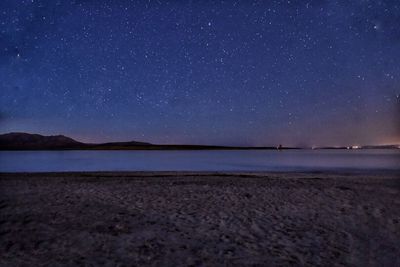 Scenic view of sea against sky at night