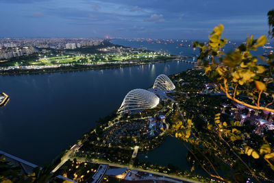 High angle view of cityscape by sea against sky