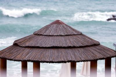 Close-up of roof on beach against sea