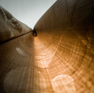 Close-up of metallic structure against sky