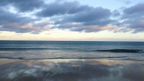 Scenic view of sea against sky at sunset