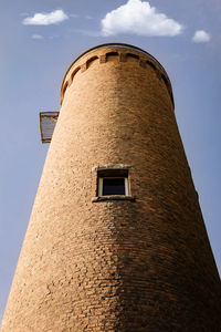 Round brick tower located in a small municipal park