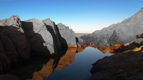 Scenic view of mountains against clear blue sky