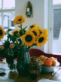 Flower vase on table at home