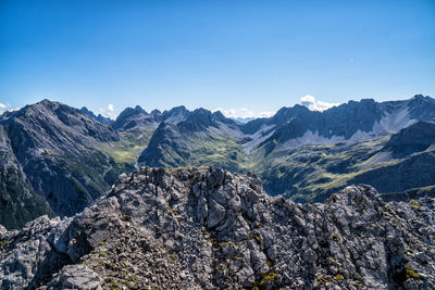 Scenic view of mountains against clear blue sky