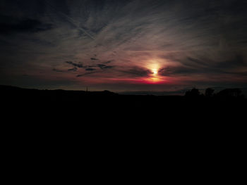 Scenic view of silhouette landscape against sky during sunset